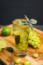 Fresh cocktail with grape, lime and basil leaves Royalty Free Stock Photo