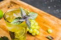 Fresh cocktail with grape, lime and basil leaves Royalty Free Stock Photo