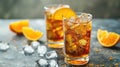 Iced tea with orange slices in tall glasses. Summer refreshment and beverage concept with space for text for banner, menu design
