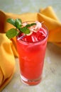 Fresh cocktail raspberries, ginger and ice. summer cocktail glass of raspberries soda drink on a light stone background