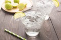 Fresh cocktail with soda, lime on a wooden background Royalty Free Stock Photo