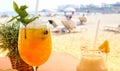 Fresh cocktails served on the table with lovely view on the beach. Food and drinks concept. Royalty Free Stock Photo