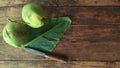 The fresh coconut banana leaf and knife on wooden floor in home