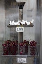 Fresh coconut and cherries sale in a stall on the streets of Venice