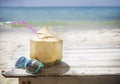 Fresh coconut cocktail and sunglasses on tropical beach Royalty Free Stock Photo