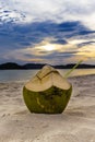 Fresh coconut cocktails on sandy tropical beach at sunset time Royalty Free Stock Photo