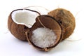 Fresh coconut flakes placed in bark and shell  on white background Royalty Free Stock Photo