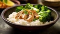 Fresh Coconut Rice Bowl With Steamed Broccoli and Garlic Chicken on Blurred Background