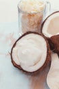 Fresh coconut split in half, coconut oil and flakes Royalty Free Stock Photo