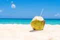 Fresh Coconut on white Caribbean Beach
