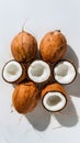 Fresh coconuts presented against a pristine white background