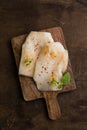 Fresh Cod Fillet on Wooden Board Royalty Free Stock Photo