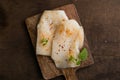 Fresh Cod Fillet on Wooden Board Royalty Free Stock Photo