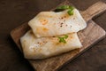 Fresh Cod Fillet on Wooden Board Royalty Free Stock Photo