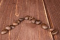 Fresh coffee bean on brown wood Royalty Free Stock Photo