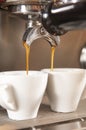 Fresh Coffee From Espresso Machine Dripping Into Cups Royalty Free Stock Photo