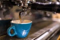 Fresh coffee prepared in the a coffee machine. Espresso in small white cups