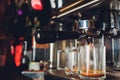 Fresh coffee prepared in the coffee machine. Espresso in small white cups.