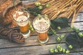 Fresh cold beer glasses in rustic setting Royalty Free Stock Photo