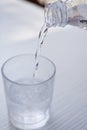 Fresh cold clear mineral water in bottle and glass on table Royalty Free Stock Photo