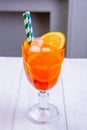 Fresh cold cocktail Aperol with orange slices and ice cubes in misted glass. Non-alcoholic summer coctails. Menu of cafe or