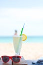 Fresh cold lemonade on a sunny beach Royalty Free Stock Photo