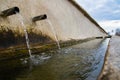 Fresh cold spring water flowing in village fountain Royalty Free Stock Photo