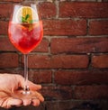 Fresh cold strawberry alcoholic drink with orange, ice and mint Royalty Free Stock Photo