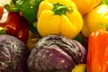 Fresh color sweet pepper, purple cauliflower mix in market Royalty Free Stock Photo