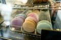 Fresh colored macaroons close-up, sale in coffee shop showcase