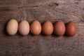 Fresh colorful eggs in a wooden background Royalty Free Stock Photo