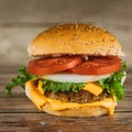 Fresh colorful homemade hamburger on wooden table Royalty Free Stock Photo