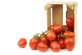 Fresh and colorful italian roma tomatoes on the vine in a wooden crate Royalty Free Stock Photo