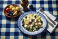 Fresh and Colorful Mediterranean Salad on a Rustic Blue and White Checkered Tablecloth, ai generative