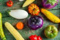 Fresh colorful organic season vegetables ingredients on rustic wooden background, top view, flat lay. Healthy, diet or