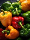 Fresh colorful peppers being rinsed and ready to be eaten