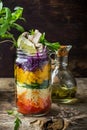 Fresh colorful salad in the jar