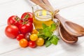 Fresh colorful tomatoes, basil and olive oil Royalty Free Stock Photo