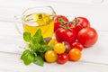 Fresh colorful tomatoes, basil and olive oil Royalty Free Stock Photo