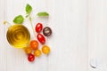 Fresh colorful tomatoes, basil and olive oil Royalty Free Stock Photo