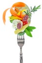 Fresh colorful vegetables and salami on fork Royalty Free Stock Photo