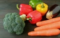 Fresh colorful vegetables scattered on wooden table Royalty Free Stock Photo