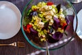 Fresh colorful yellow green cauliflower broccoli salad with goat cheese