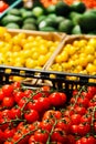 Fresh colourful cherry tomatoes in boxes at market