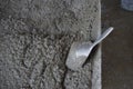 Fresh concrete sampling for testing by aluminium scoop Royalty Free Stock Photo