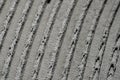 Fresh concrete tehture with patterns of notched trowel. Macro shot of grey surface cement putty on wall with vertical Royalty Free Stock Photo