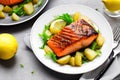 Fresh cooked delicious salmon steak with salad lemon potato