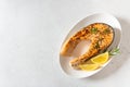 Fresh cooked delicious salmon steak with spices and herbs. Healthy seafood. Restaurant menu, recipe. Roasted trout steak served on Royalty Free Stock Photo
