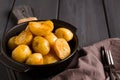 Fresh Cooked, new potatoes,with dill, on a wooden table, selective focus. close-up, toning, no people, Royalty Free Stock Photo