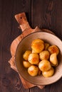 Fresh Cooked, new potatoes,with dill, on a wooden table, selective focus. close-up, toning, no people, Royalty Free Stock Photo